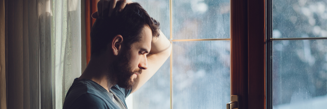 My Heart Hurts and I Can’t Take It Young sad mad sitting by the window in regret