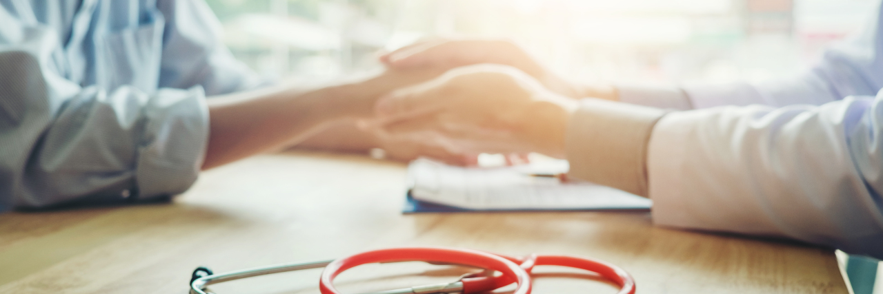 Medically Transitioning as Transgender With a Congenital Heart Defect Doctor holding patient's hands