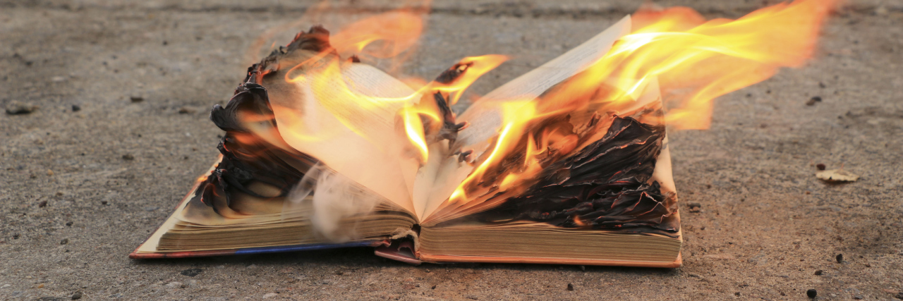 Burning book on pavement