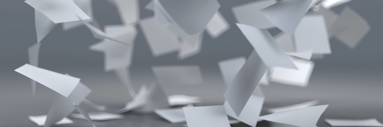 Getting a Power Wheelchair Covered By Insurance Sheets of paper flying in the wind.