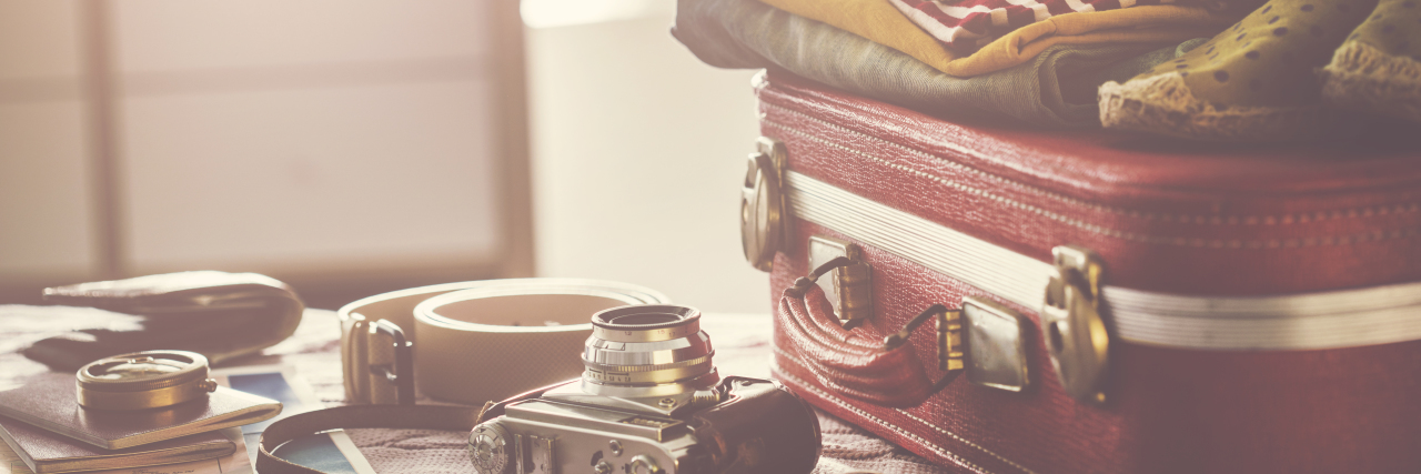 Tips for Traveling With Hearing Loss Suitcase and supplies for travel.