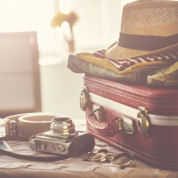 Suitcase and supplies for travel.