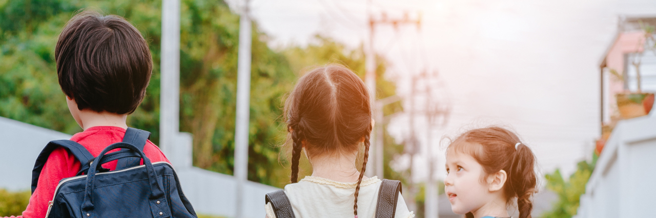 Parenting a Child With Illness: Lessons Learned kids holding hands together, an adult in the middle