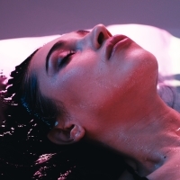 a woman is floating in a spa or pool