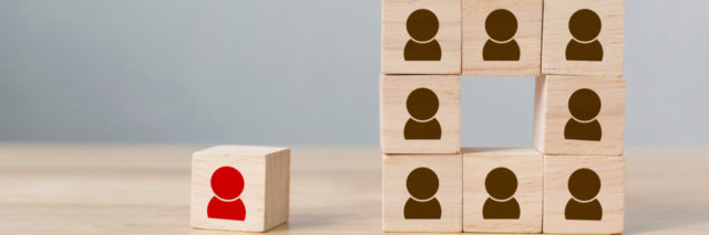 Succeeding 'Outside the Box' in My Life With a Learning Disability Single block with outline of a person, apart from other person blocks stacked to form a square.