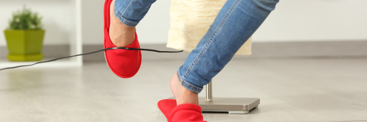 Being Undiagnosed and Experiencing Clumsiness and Brain Fog woman's legs tripping over an electrical cord at home