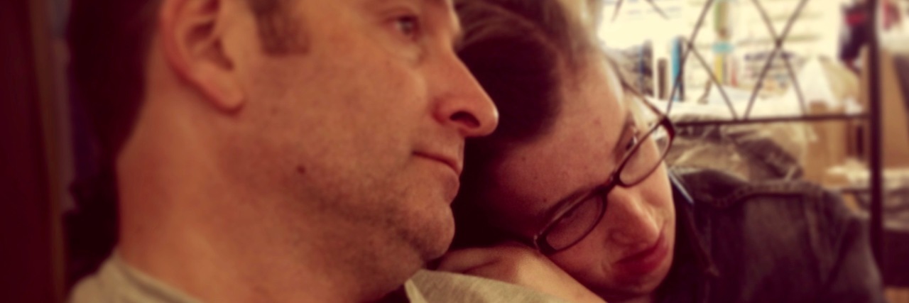 Meeting a Woman With a Disability Who Reminded Me of My Child Daughter laying her head on her father's shoulder