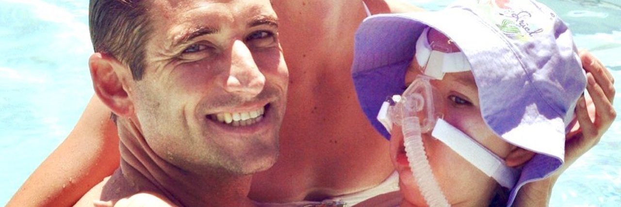 To the Parents of Children With Disabilities, I'm Sorry for Staring Mother and father swimming with disabled daughter