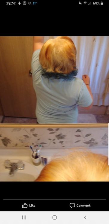 back of woman's head with badly orange-blonde bleaching