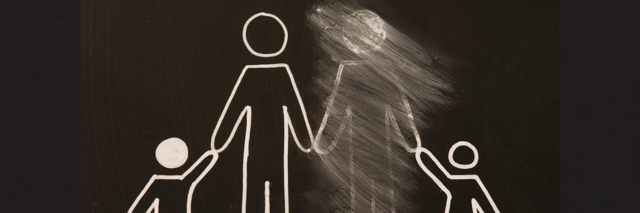 Celebrating Father's Day With an Absent Father A stick figure of a family with the father blurred out.