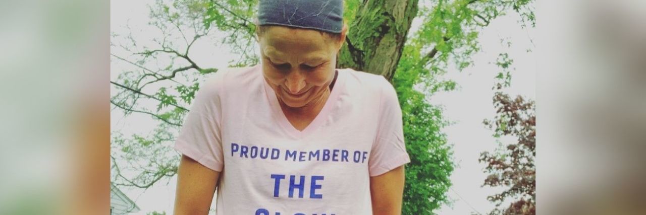 8 Things I Want You to Understand About Rheumatoid Arthritis woman wearing tshirt that says proud member of the slow runners club