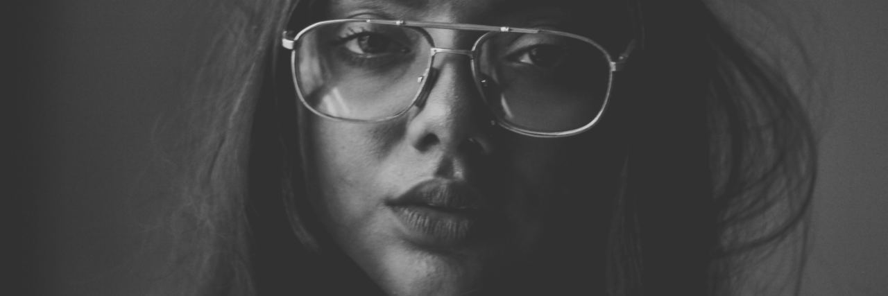 Borderline Personality Disorder and How My Parents Made Fun of Emotion black and white photo of woman looking sad