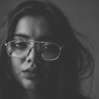 black and white photo of woman looking sad