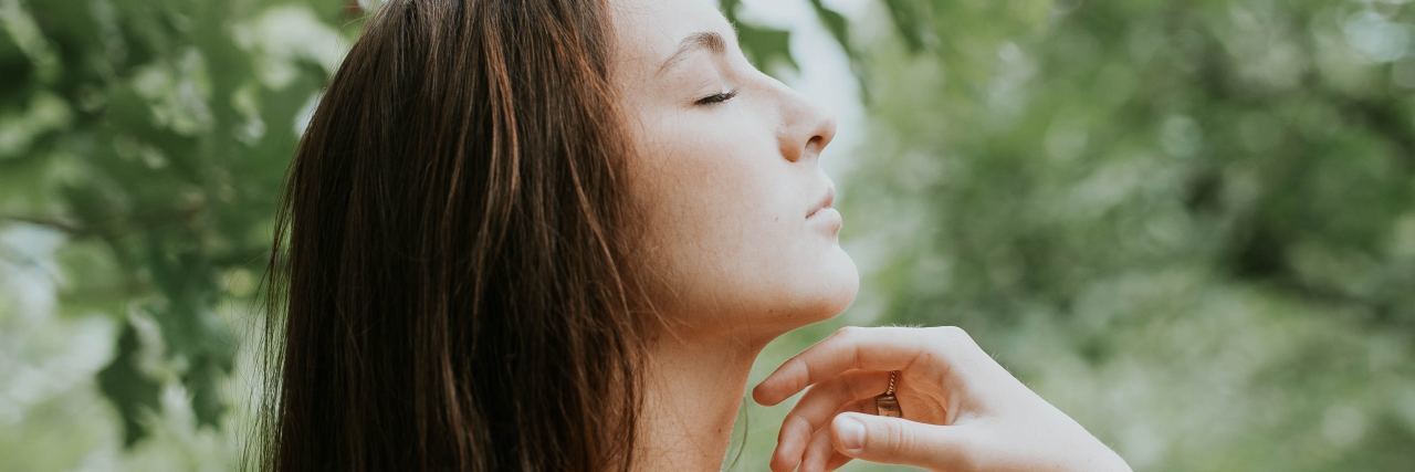 How Biofeedback Therapy Helps Me to Instantly Control My Anxiety photo of young woman in side profile with eyes closed and breathing