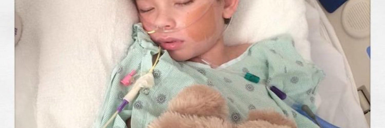 What to Know About Febrile Infection Related Epilepsy Syndrome the author's son lying in a hospital bed