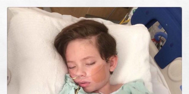 Why I'm Raising Awareness for a Rare Kind of Epilepsy the author's son lying in a hospital bed