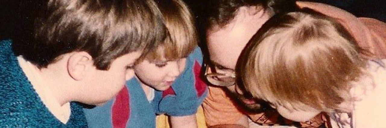 How Our Children's Experiences Define Their Passions Family gathered around.