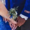 Couple dressed for prom holding hands