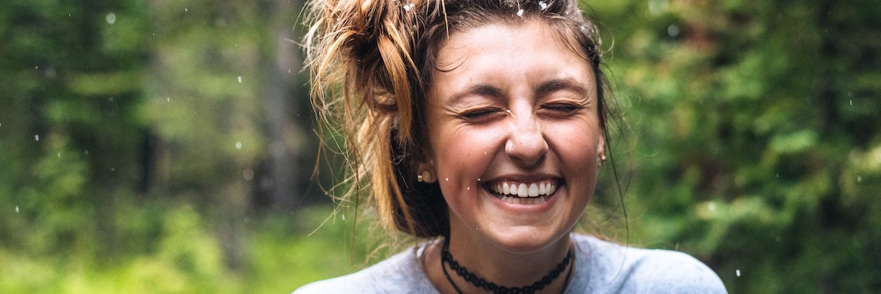 A woman smiling