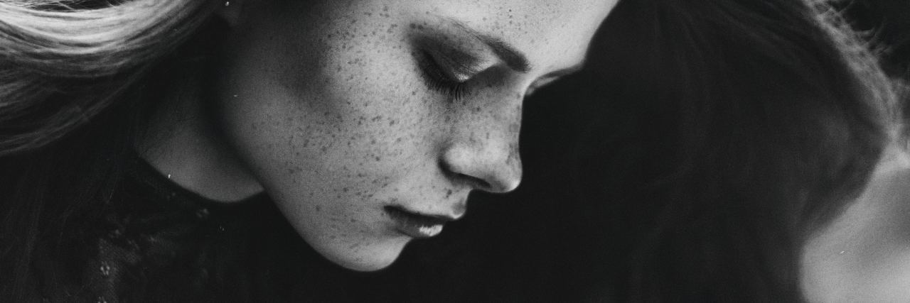 What You Need to Know If You Didn't Eat Today black and white photo of young woman with long hair looking down