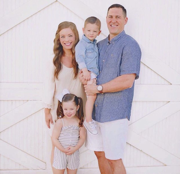 family posing inside