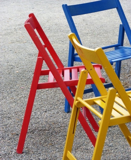 Colorful wooden chairs.