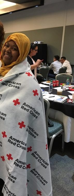 woman in blanket at conference 