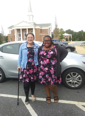 the author and her friend smiling