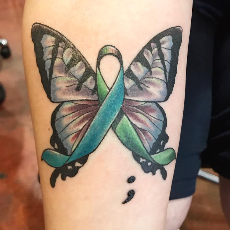 turquoise awareness ribbon with burgundy butterfly wings