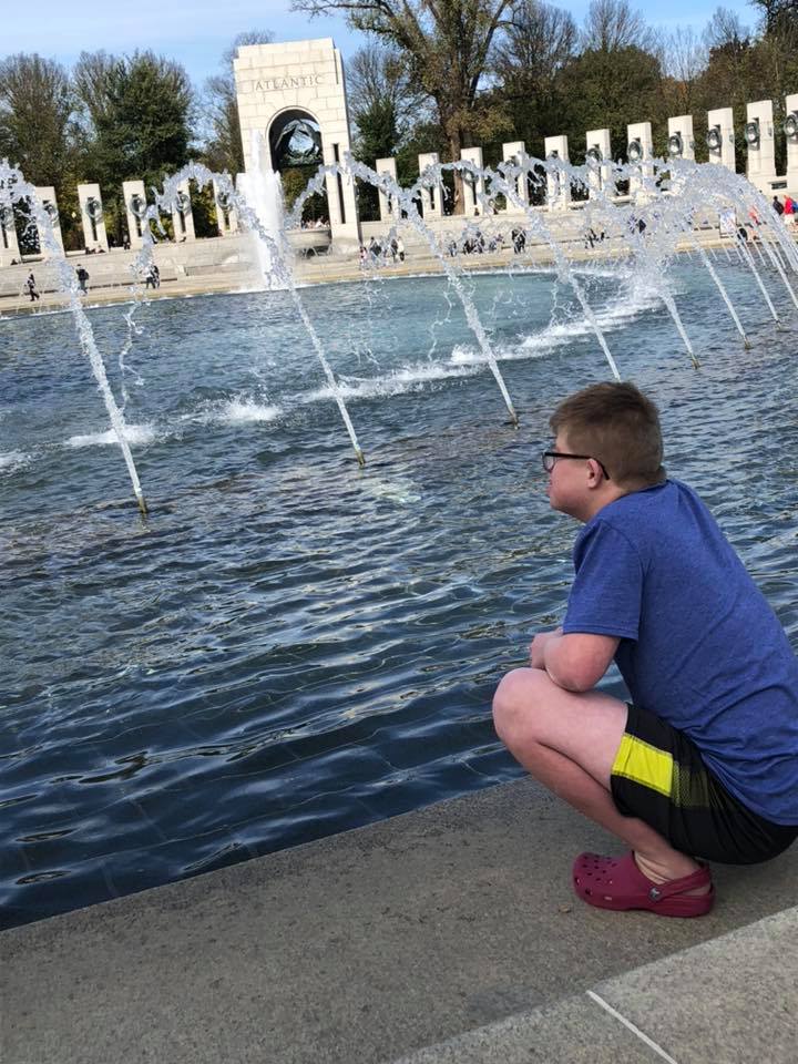 Alex looking at a fountain in Washington, D.C.