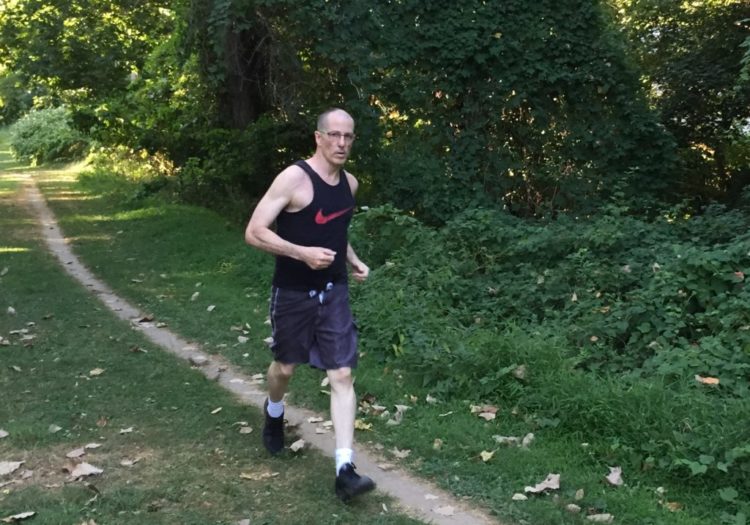 bruce ballard running on nature path