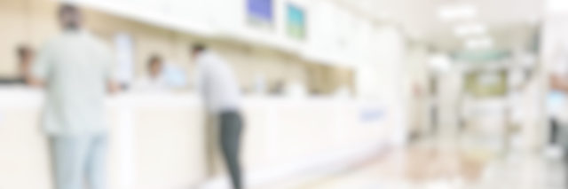 Medical blur background customer reception or patient service counter, office lobby in hospital clinic, or bank business building blurry interior inside waiting hall area