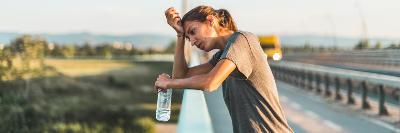 Tips for Dealing With Lupus Heat Intolerance A woman overheating outside