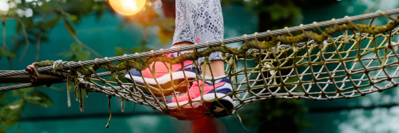 The Right to Take Risks as a Person With a Disability Girl on a rope bridge
