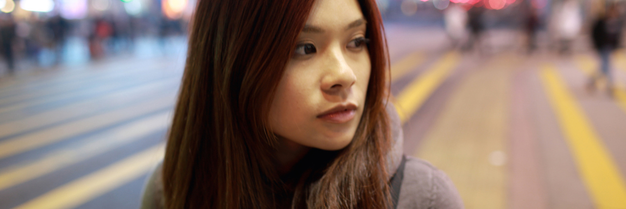 When You Don't Want to Leave a Psychiatric Hospital A woman on the street in a busy city