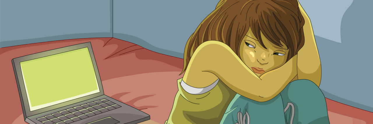 Taking Sick Leave at Work for Bipolar Disorder: What I Tell My Boss sad girl sitting alone next to her open laptop