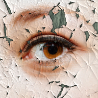 Cracked painting of a woman's face.