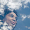 woman looking at clouds