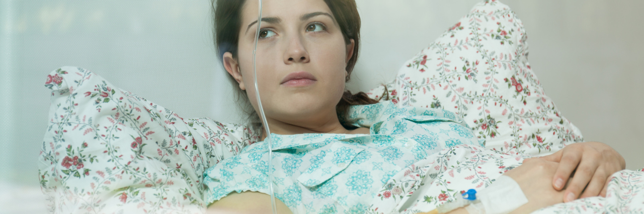 Why I Forgave Myself for How I Treated My Family While in the Hospital Ill young woman lying in hospital bed