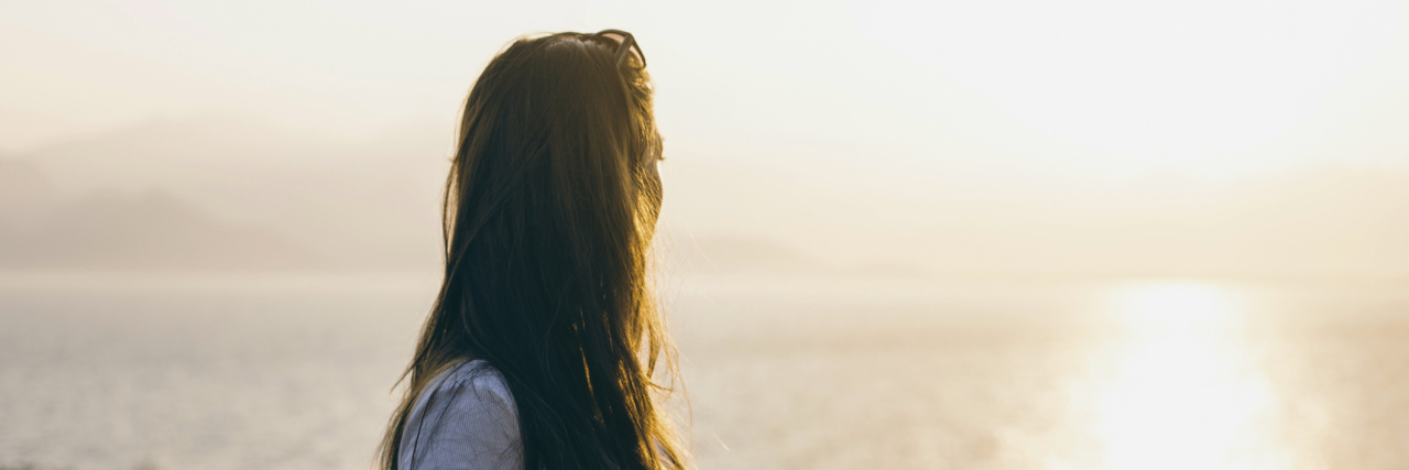 Existential Therapy Techniques Help You Find Meaning in Your Life Portrait of female looking seascape