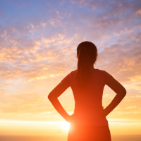 silhouette of sport woman look somewhere with sunlight