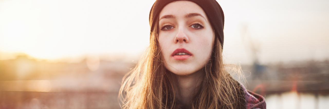 Suicidal Thoughts Not Taken Seriously at the Emergency Room A young woman wearing a beanie at dusk