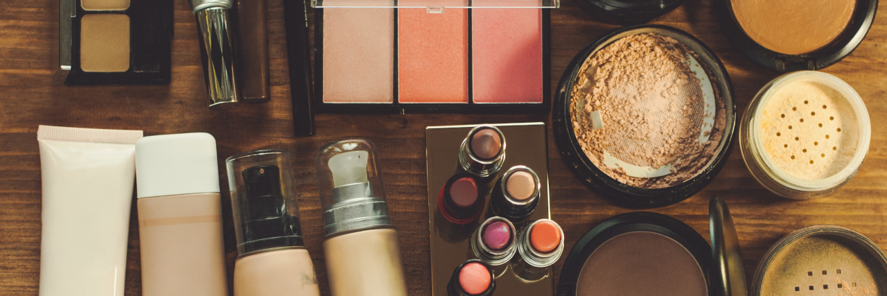 Adapting Daily Tasks With Muscular Dystrophy Cosmetics on table.