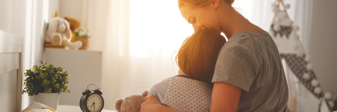 Self-Care for Parents of Children With Type 1 Diabetes morning awakening. mother wakes her daughter in bed in morning