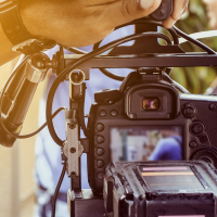 Person using film camera.