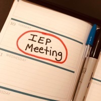 Planner with words "IEP meeting" circled