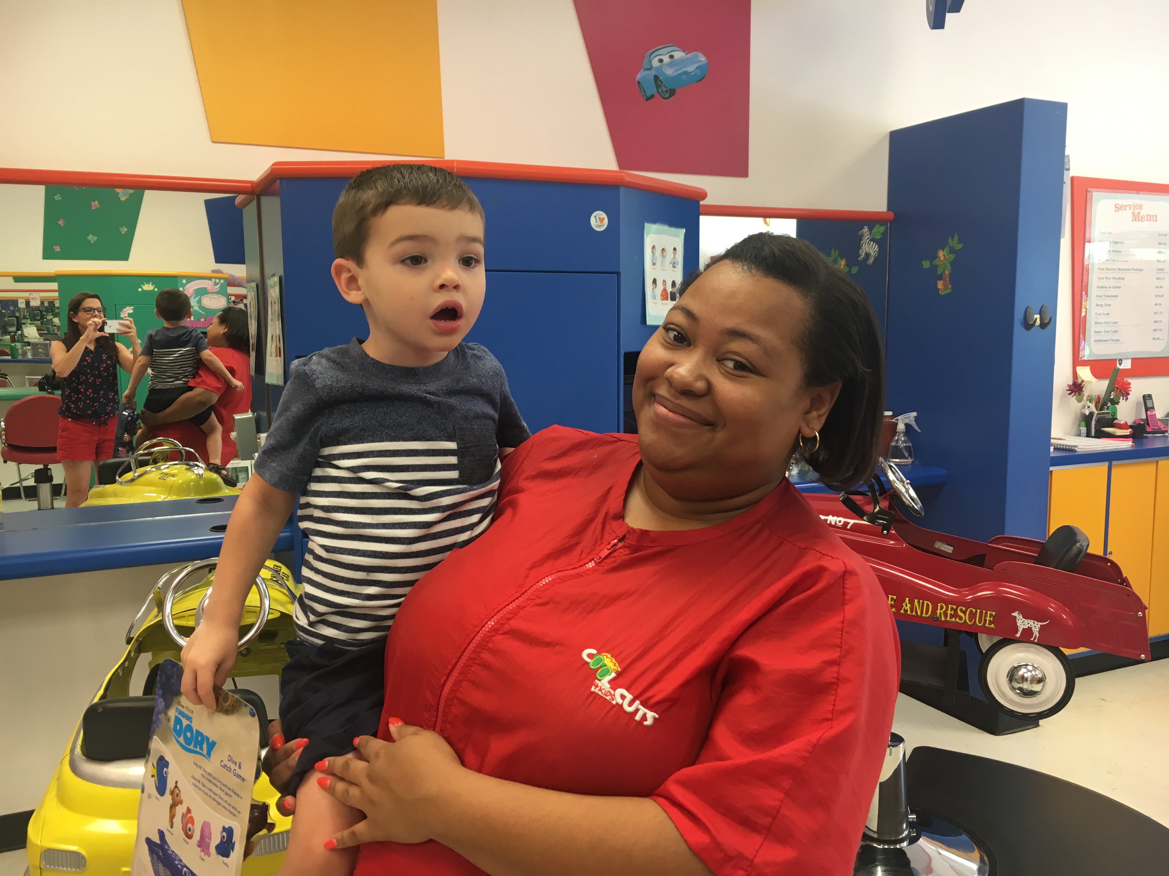 Amy's son with his hairstylist, Miss Karis.