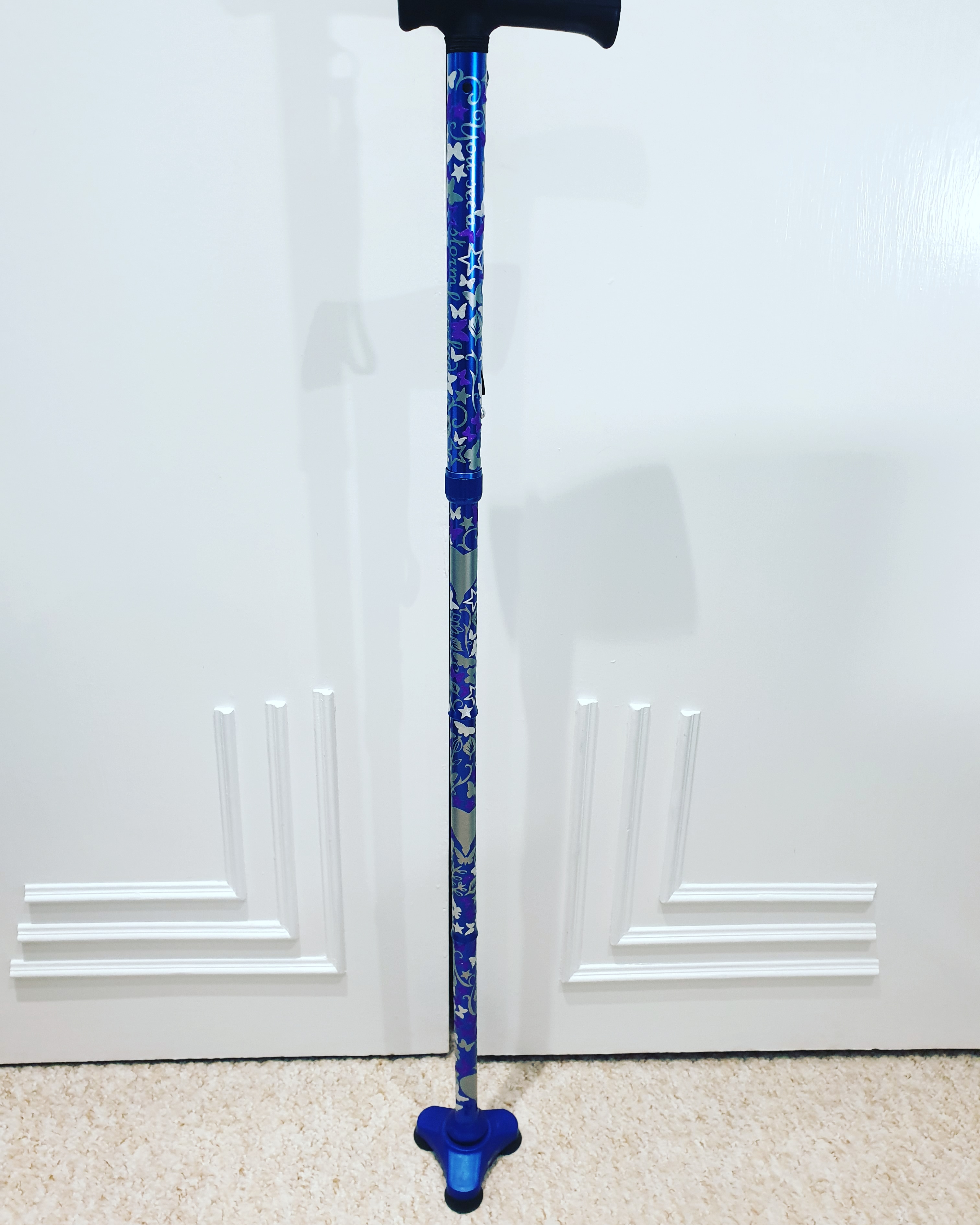 Elaine's cane decorated with cricut vinyl.