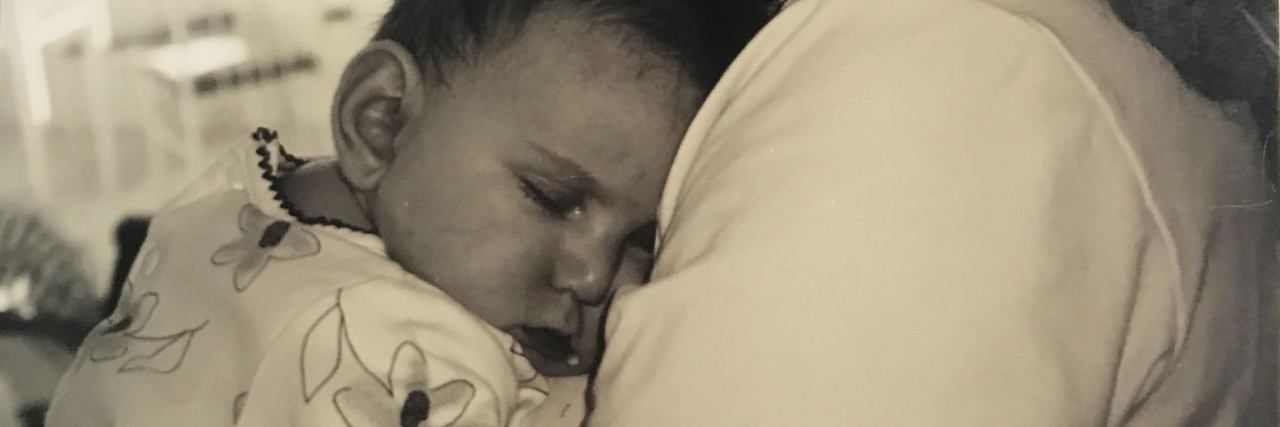 Experiencing Grief as a Mother After Losing a Child The author holding her baby