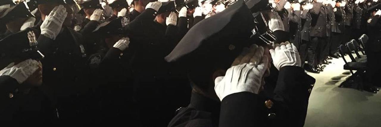 NYPD saluting during police academy graduation